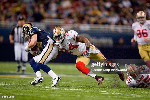 Michael Robinson of the San Francisco 49ers moves to tackle Danny Amendola of the St. Louis Rams at the Edward Jones Dome on January 3, 2010 in St....