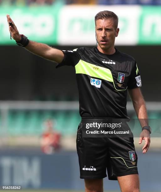 Referee Davide Massa gestures during the serie A match between AC Chievo Verona and FC Crotone at Stadio Marc'Antonio Bentegodi on May 6, 2018 in...