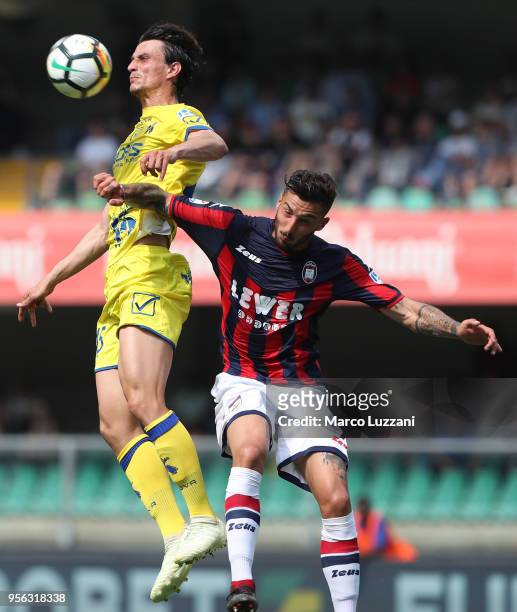 Roberto Inglese of AC Chievo Verona competes for the ball with Federico Ceccherini of FC Crotone during the serie A match between AC Chievo Verona...