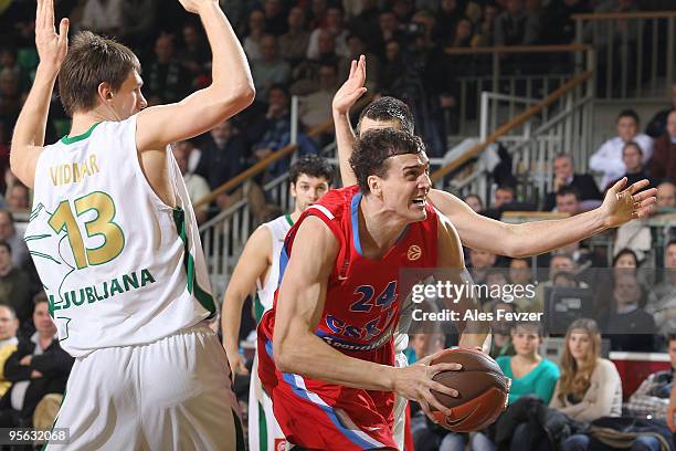 InSasha Kaun, #24 of CSKA Moscow driving past Gasper Vidmar, #13 of Union Olimpija during the Euroleague Basketball Regular Season 2009-2010 Game Day...