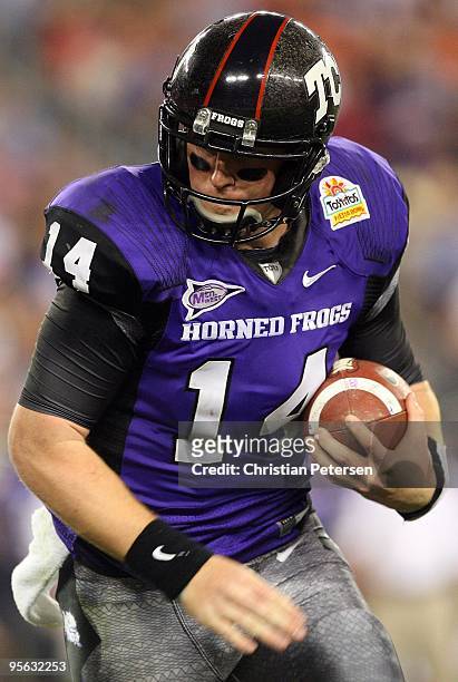 Quarterback Andy Dalton of the TCU Horned Frogs runs the ball against the Boise State Broncos during the Tostitos Fiesta Bowl at the Universtity of...