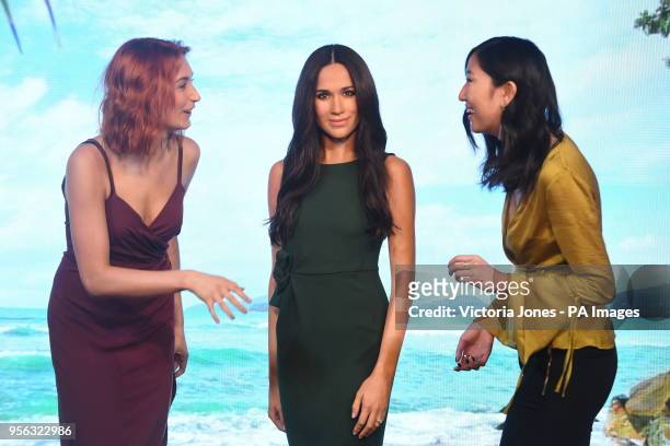 Meghan Markle's wax figure is admired after being unveiled at Madame Tussauds in central London.