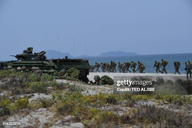 Philippine and US marines simulate an amphibious landing as part of the annual joint military exercise at the beach of Philippine navy's training...