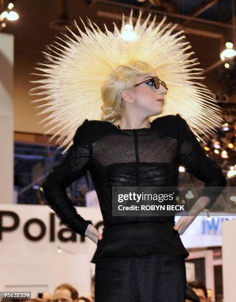 Pop star Lady Gaga appears at the Polaroid booth to announce a design partnership with the company, at the 2010 International Consumer Electronics...