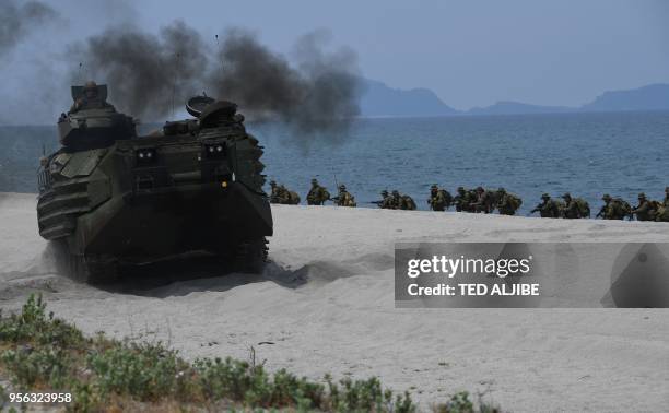 Marines assault amphibious vehicle drives part Philippine marines as they simulate an amphibious landing as part of the annual joint military...