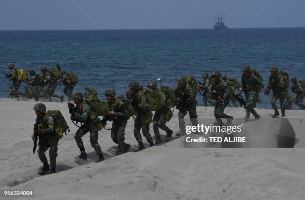 Philippine marines take position as navy's frigate Alcaraz standsby during the amphibious landing as part of the annual Philippines and US joint...