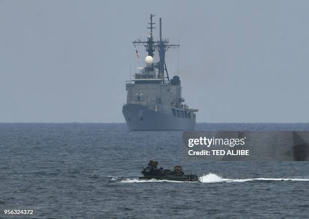 Assault amphibious vehicle manoeuvers past Philippine navy's frigate Ramon Alcaraz during the amphibious landing as part of the annual Philippines...