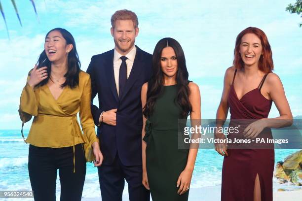 Meghan Markle's wax figure is admired after being unveiled alongside Prince Harry's at Madame Tussauds in central London.