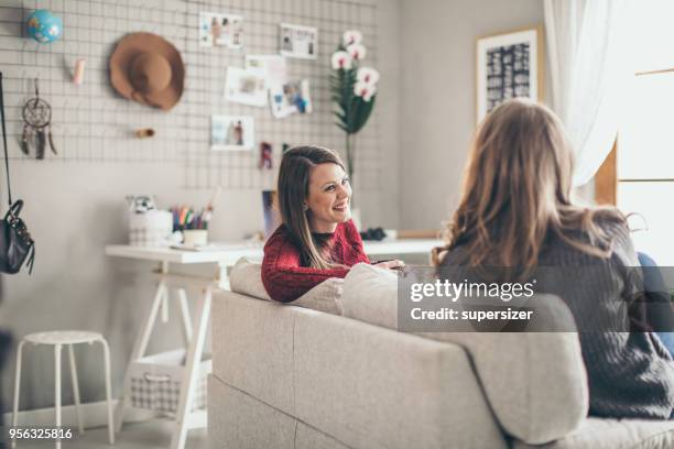 two college girls relaxing - flatmate stock pictures, royalty-free photos & images