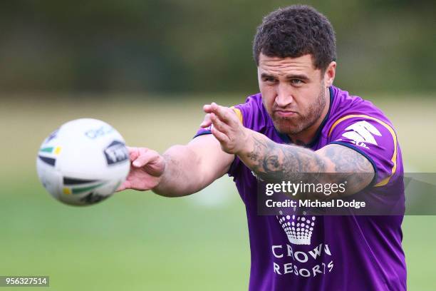 Jesse Bromwich of the Storm passes the ball during a Melbourne Storm NRL training session at AAMI Park on May 9, 2018 in Melbourne, Australia.
