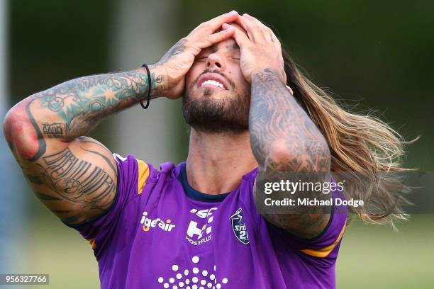 Sandor Earl ties up his hair during a Melbourne Storm NRL training session at AAMI Park on May 9, 2018 in Melbourne, Australia.