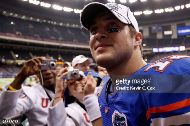 Quarterback Tim Tebow of the Florida Gators celebrates after defeating the Cincinnati Bearcats 24-51 during the Allstate Sugar Bowl at the Louisana...