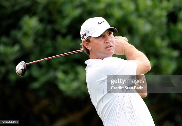 Lucas Glover hits from the first tee box during the first round of the SBS Championship at Plantation Course at Kapalua on January 7, 2010 in...