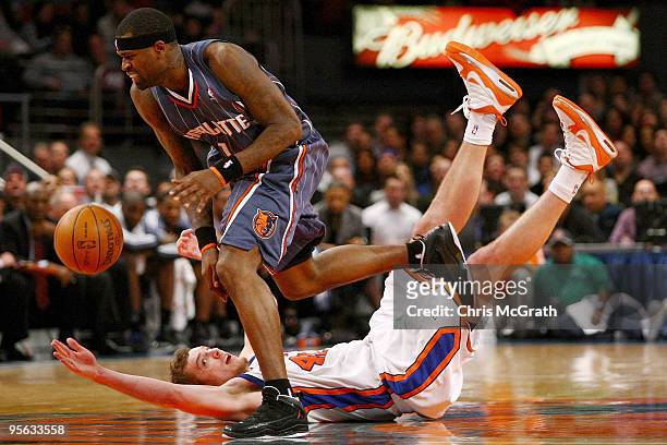 David Lee of the New York Knicks falls trying to steal the ball from Stephen Jackson of the Charlotte Bobcats at Madison Square Garden January 7,...
