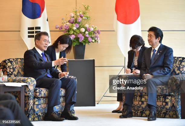 South Korea's President Moon Jae-in and Japan's Prime Minister Shinzo Abe hold their meeting at Abe's official residence in Tokyo on May 9, 2018.