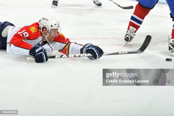 Dominic Moore of Florida Panthers reaches for the puck during the NHL game against Montreal Canadiens on January 7, 2010 at the Bell Centre in...