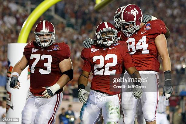 Running back Mark Ingram of the Alabama Crimson Tide celebrates a touchdown against the Texas Longhorns with his teammates in the second quarter of...