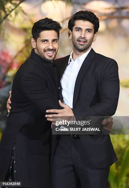 Indian Bollywood actors Sidhharth Malhotra and Aditya Roy Kapur pose for a picture during the wedding reception of actress Sonam Kapoor and...