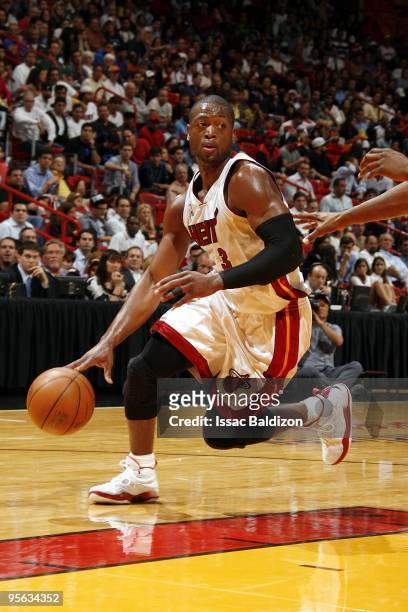 Dwyane Wade of the Miami Heat moves the ball up court during the game against the Orlando Magic at American Airlines Arena on December 17, 2009 in...