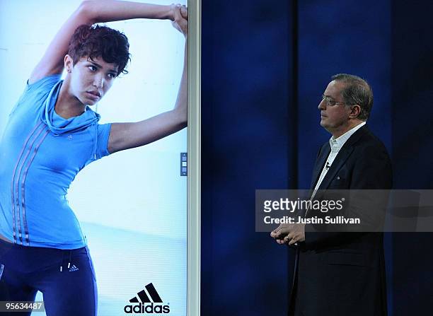 Intel President and CEO Paul Otellini looks at a video ad as he delivers a keynote address during the 2010 International Consumer Electronics Show at...