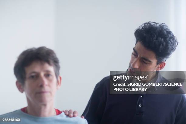 physiotherapy consultation - sigrid gombert stock pictures, royalty-free photos & images