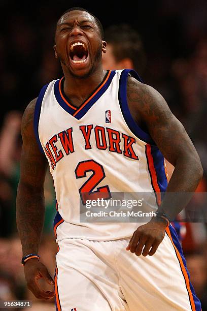 Nate Robinson of the New York Knicks celebrates a slam dunk against the Charlotte Bobcats at Madison Square Garden January 7, 2010 in New York City....