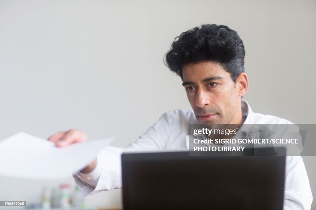 Doctor working on laptop