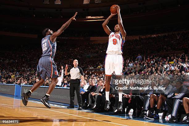 Jonathan Bender of the New York Knicks shoots against Ronald Murray of the Charlotte Bobcats on January 7, 2010 at Madison Square Garden in New York...