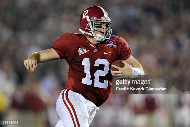 Quarterback Greg McElroy of the Alabama Crimson Tide runs with the ball against the Texas Longhorns in the second quarter of the Citi BCS National...