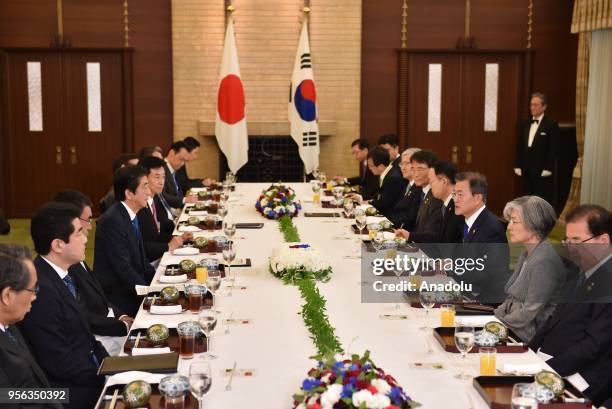 South Korea's President Moon Jae-in and Japan's Prime Minister Shinzo Abe hold their luncheon meeting at the Prime Minsiter's former official...