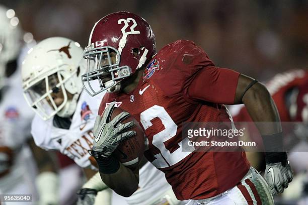 Running back Mark Ingram of the Alabama Crimson Tide runs with the ball against the Texas Longhorns during the Citi BCS National Championship game at...