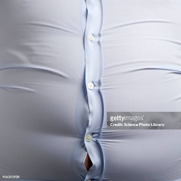overweight man with bulging shirt buttons - full frontal stock-fotos und bilder