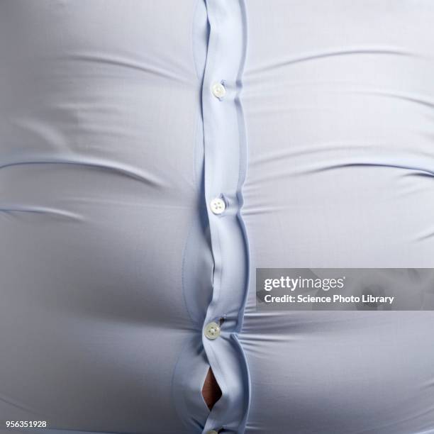 overweight man with bulging shirt buttons - tight shirt stock pictures, royalty-free photos & images