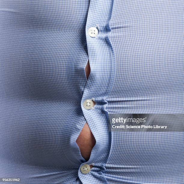 overweight man with bulging shirt buttons - belly button ストックフォトと画像