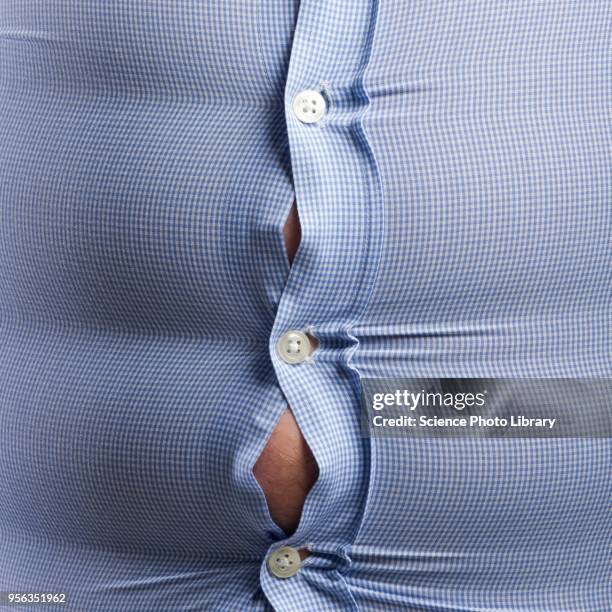 overweight man with bulging shirt buttons - tight shirt stock pictures, royalty-free photos & images