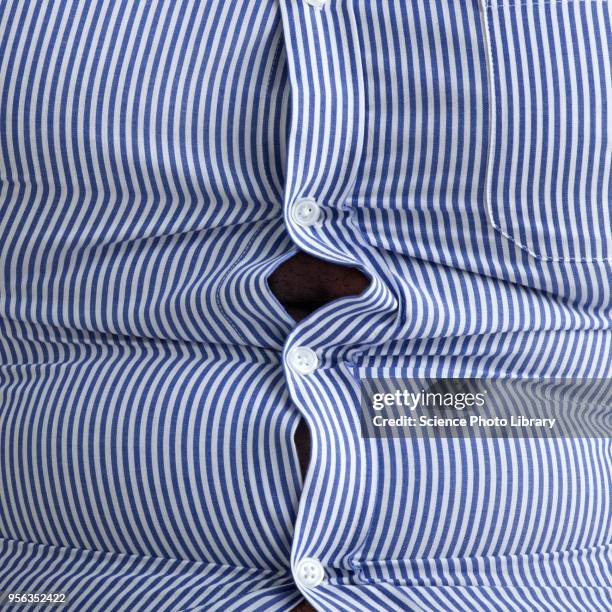 overweight man with bulging shirt buttons - belly button ストックフォトと画像