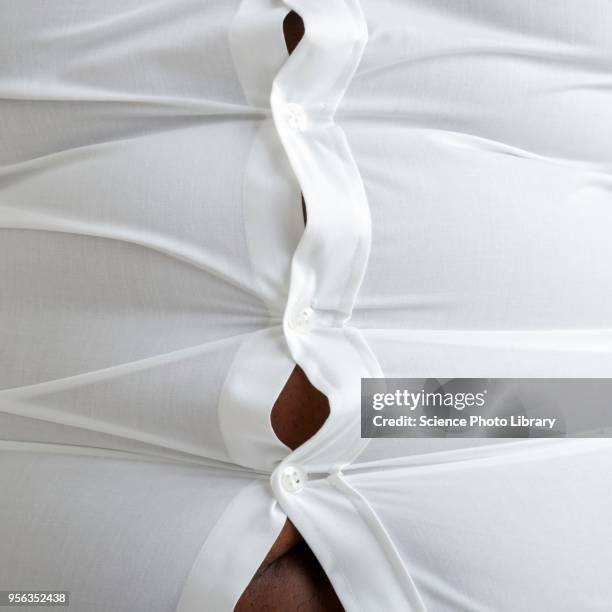 overweight man with bulging shirt buttons - tight shirt stock pictures, royalty-free photos & images