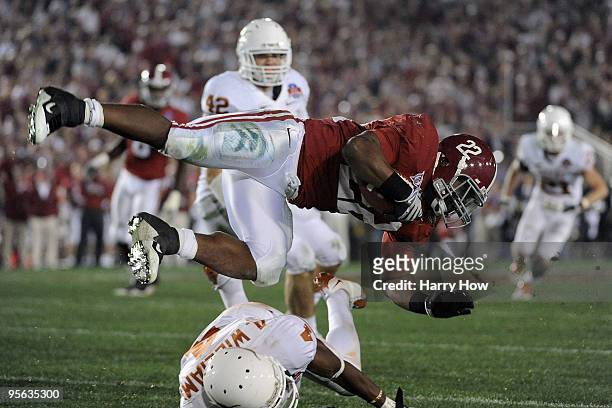 Running back Mark Ingram of the Alabama Crimson Tide is tackled by cornerback Aaron Williams of the Texas Longhorns during the Citi BCS National...