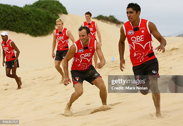 Jude Bolton and team mates take part in a skills session during a Sydney Swans AFL training session at the Kurnell sand dunes on January 8, 2010 in...