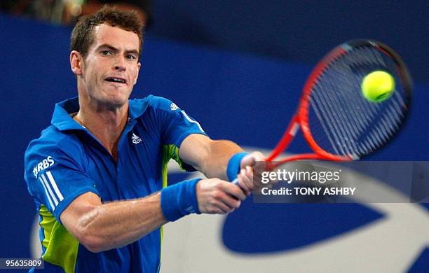 Andy Murray of Britain returns against Igor Andreev of Russia during their singles tennis match on the tenth session during day seven of the Hopman...