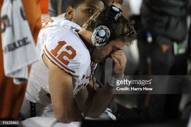 Quarterback Colt McCoy of the Texas Longhorns sits on the bench during the Citi BCS National Championship game against the Alabama Crimson Tide at...