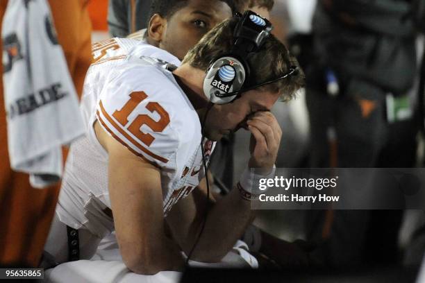 Quarterback Colt McCoy of the Texas Longhorns sits on the bench during the Citi BCS National Championship game against the Alabama Crimson Tide at...