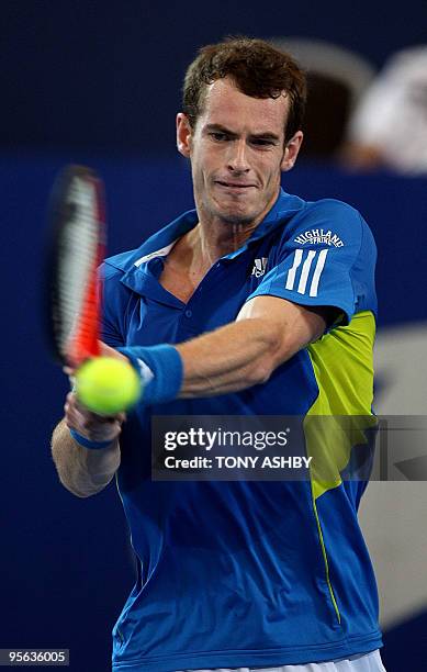 Andy Murray of Britain returns against Igor Andreev of Russia during their singles tennis match on the tenth session during day seven of the Hopman...