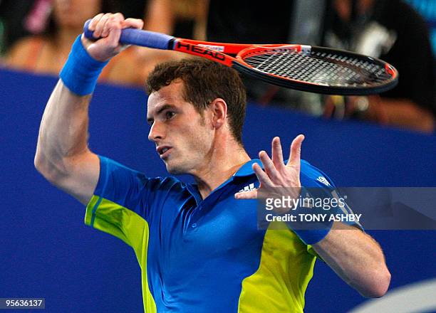 Andy Murray of Britain returns against Igor Andreev of Russia during their singles match on the tenth session, day seven of the Hopman Cup in Perth...
