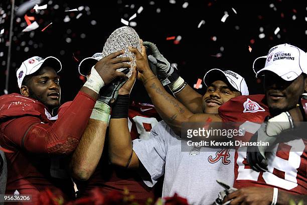 Running back Mark Ingram and the Alabama Crimson Tide celebrate with the BCS Championship trophy after winning the Citi BCS National Championship...