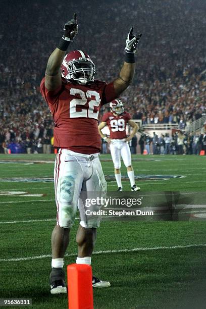 Running back Mark Ingram of the Alabama Crimson Tide celebrates after an extra point during the Citi BCS National Championship game against the Texas...