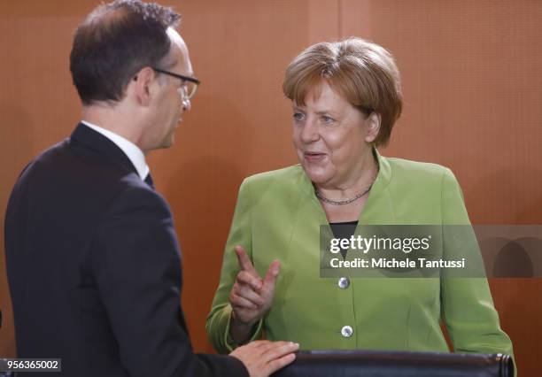 German Chancellor Angela Merkel and Foreign Minister Heiko Maas arrive for the weekly government cabinet meeting on May 9, 2018 in Berlin, Germany....