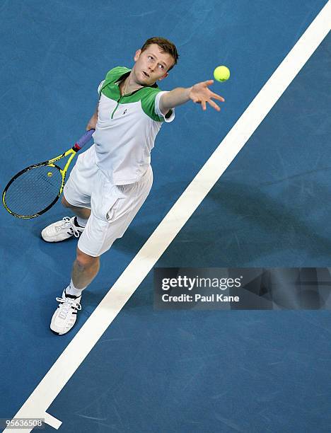 Andrey Golubev of Kazakhstan plays a serves in his game against Phillip Kohlschreiber of Germany in the Group B match between Germany and Kazakhstan...