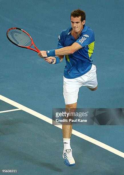 Andy Murray of Great Britain plays a backhand shot in his match against Igor Andreev of Russia in the Group B match between Great Britain and Russia...