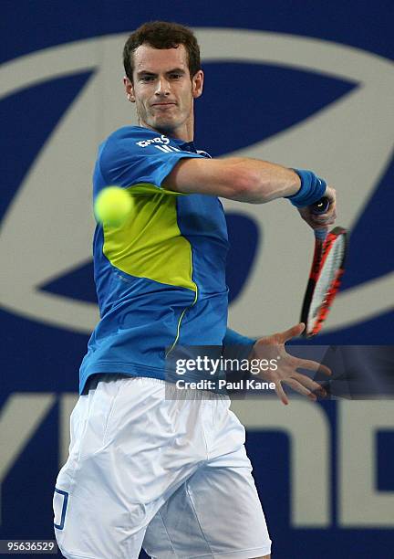 Andy Murray of Great Britain plays a forehand shot in his match against Igor Andreev of Russia in the Group B match between Great Britain and Russia...